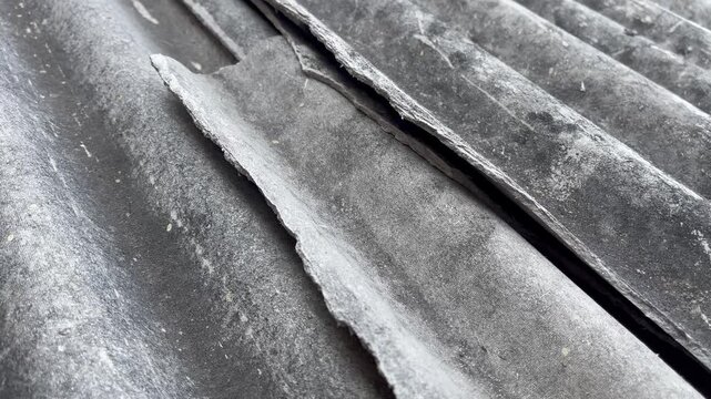 Cracked and broken asbestos roof sheet texture background