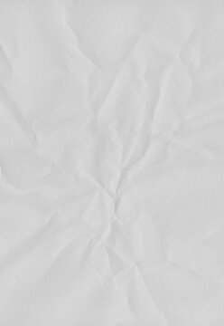 Radial crumpled paper texture with central fold points and soft shadow gradients creates a dynamic focal point for artistic photo framing or vintage document style backgrounds.