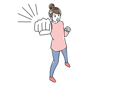 ガッツポーズをする女性