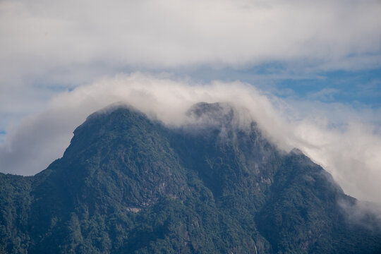 Majestic green mountains covered by flowing white clouds in Y Ty, Lao Cai province, Vietnam