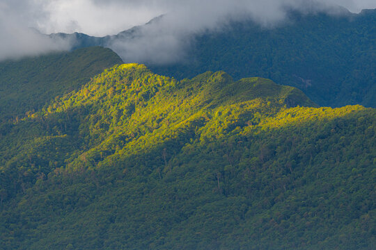 Majestic green mountains covered by flowing white clouds in Y Ty, Lao Cai province, Vietnam