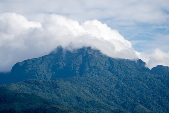 Majestic green mountains covered by flowing white clouds in Y Ty, Lao Cai province, Vietnam