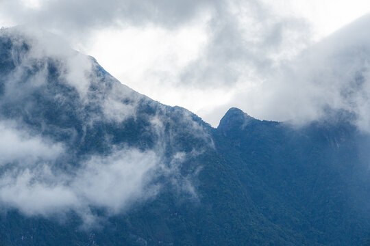 Majestic green mountains covered by flowing white clouds in Y Ty, Lao Cai province, Vietnam