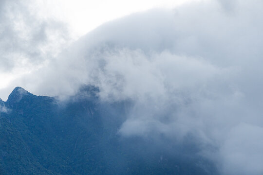 Majestic green mountains covered by flowing white clouds in Y Ty, Lao Cai province, Vietnam