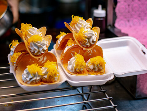 Thai Crispy Pancakes Khanom Buang with Meringue Cream and Golden Shredded Egg Yolk Topping
