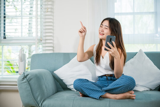 woman wireless earphone chill listen song and a little dancing from music application smartphone