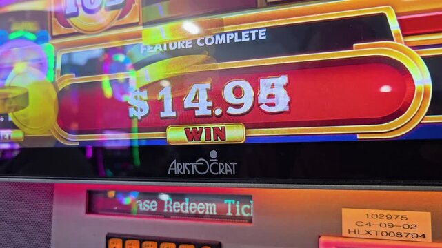 Close-up of slot game win screen with large credit count, gold framed display, confetti graphics, and saturated casino colors for jackpot, prize, and gaming entertainment videos.