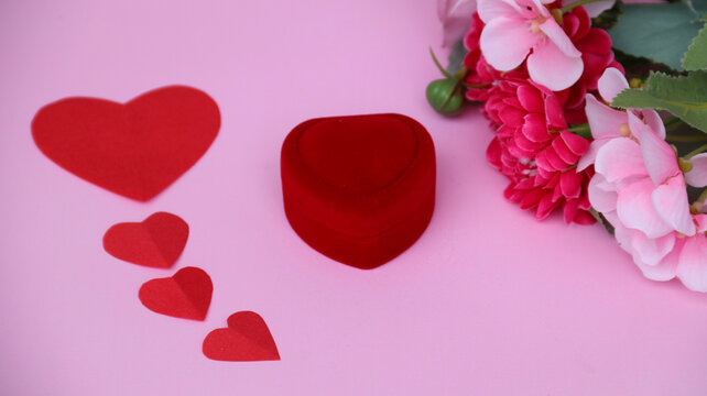 Red velvet ring box with heart shape and romantic decoration