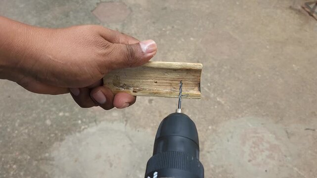drilling a piece of bamboo