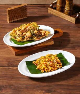 Indonesian Crispy Shrimp Fritters Bakwan Udang and Corn Fritters Bakwan Jagung Served on Banana Leaf Plates
