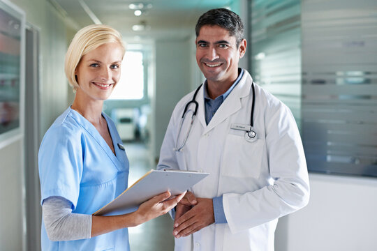 Portrait, doctor and nurse in hospital at clipboard, medical report and patient chart for diagnosis. People, healthcare and team in workplace with checklist, pathology results and surgery guidelines
