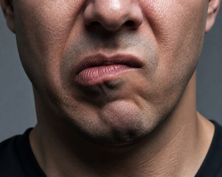 Sneering mouth close-up, emotion and attitude concept