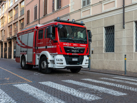Vigili del Fuoco MAN fire truck responding to an emergency in an Italian city street, preparedness and safety