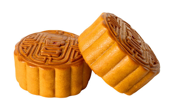 Two mooncakes isolated on transparent background, tradition Chinese moon cake, sweet dessert for mid autumn celebration. Happy Chinese translation mid autumn festival.