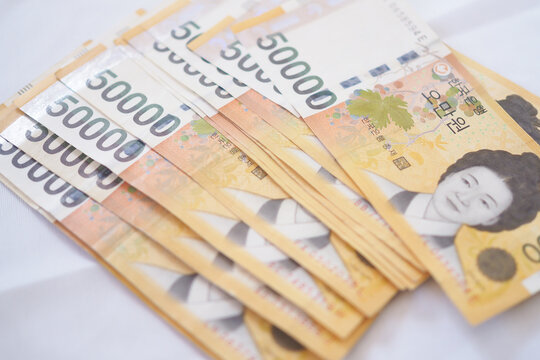 The currency of Korea which is used to represent value in exchange and the won is the main currency of Korean people. Korean won notes for money concept background.