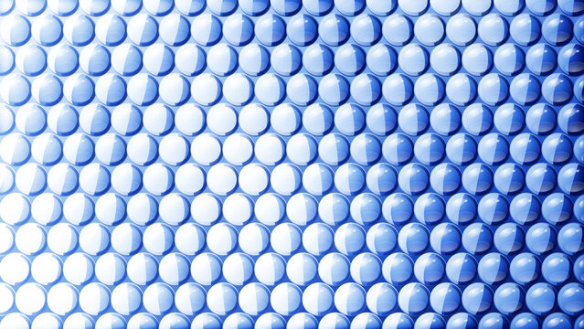 Abstract blue background texture featuring a repetitive pattern of glossy raised circular dots with gradient lighting