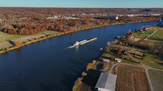 Aerial shot flying toward a barge on the Cumberland River in Ashland City, TN