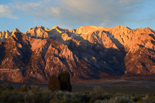 Majestic sierra nevada mountain peak glows with golden sunrise light evoking awe and serene natural majesty during peaceful morning landscape view