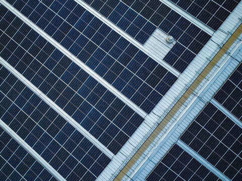 Aerial view of solar panels installed on a metal roof in Salatiga, Central Java, Indonesia.