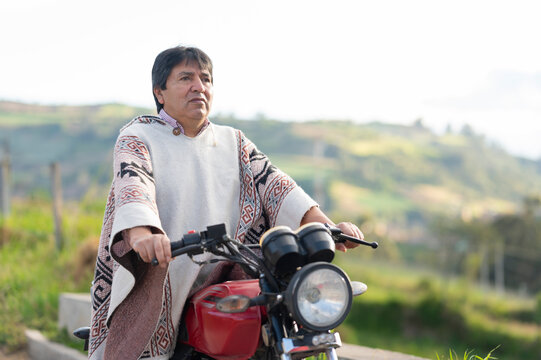 Middle-aged man riding a motorcycle in South America