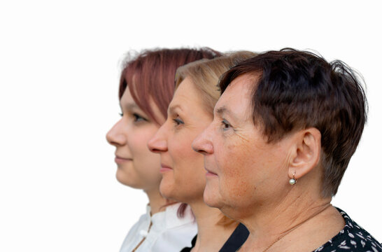 Profile side faces view of serious attractive grandmother posing with middle aged daughter and teen granddaughter standing together in row, three generations of women, family unity, bonding and ties.