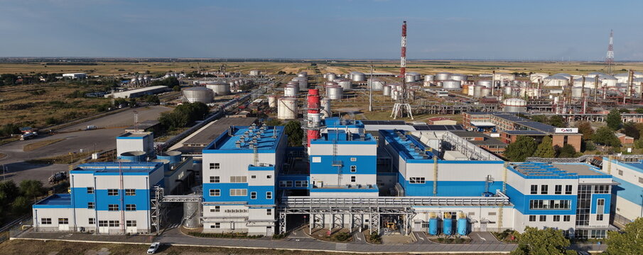 Aerial view of the NIS oil refinery in the south industrial zone featuring large storage tanks, processing units, and industrial infrastructure in Pancevo, Serbia.