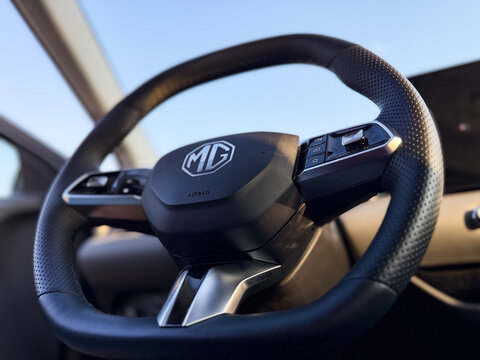 Close up of a modern mg car steering wheel with control buttons inside a clean vehicle interior. MG S5 EV electric Poland, Pszczyna, 3.08.2026 

