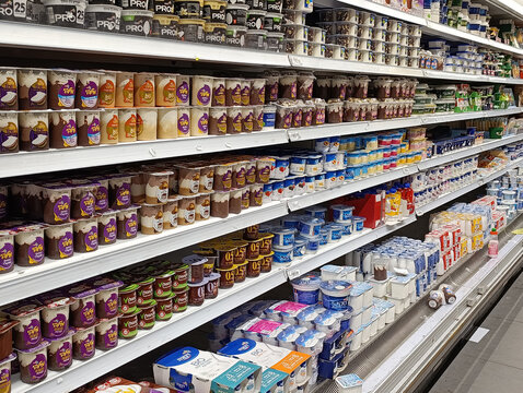 Ramla, Israel - 9 Aug 2026. Assorted dairy products, yogurts, cottage cheese on supermarket shelves. Rising prices, inflation, economic crisis, taxes and price increase in Israel in shekels.