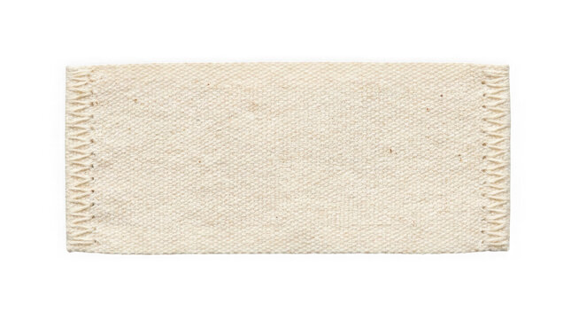 Beige woven fabric patch with decorative zigzag stitched edges isolated on white background