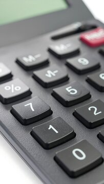 Close-up view of calculator buttons and display screen.