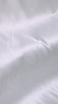 Animation of silver balloons over silver background