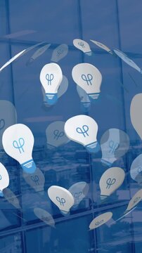 Animation of globe formed with light bulbs over cityscape