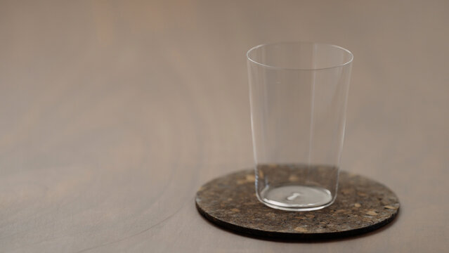 empty a glass on a wood table