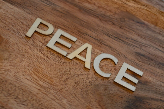 Peace message on wooden surface