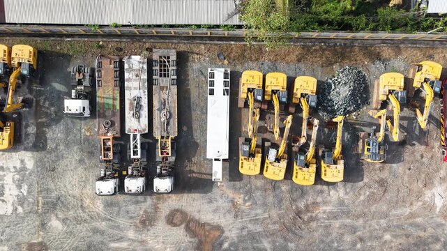 Excavator sales or rental places, many excavators are parked in a row to be shown off