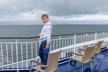 Fototapeta premium Children, playing on a ferry boat while traveling from Helsinki to Tallinn