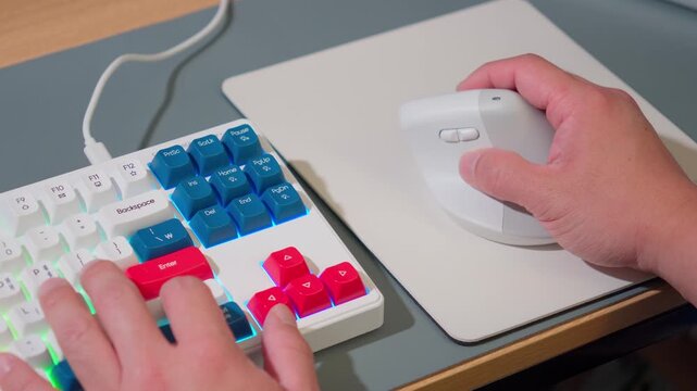 Modern Workspace Closeup Person Hands Typing and Using Vertical Computer Mouse