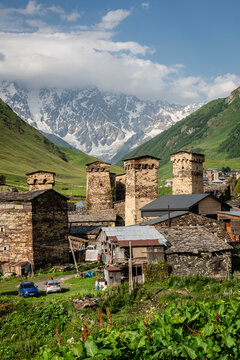 Ushguli village with the snowy mountain in the background, trans-Caucasian trail, Upper Svaneti, Caucasus mountain range, Georgia