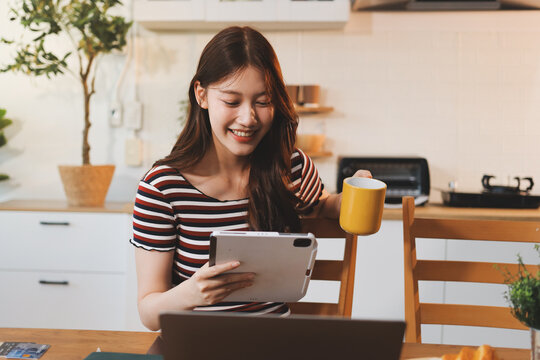 Asian woman using computer remote for business studying, watching online virtual webinar training meeting, video call. asian business woman talking on laptop in home office. Banner, copy space