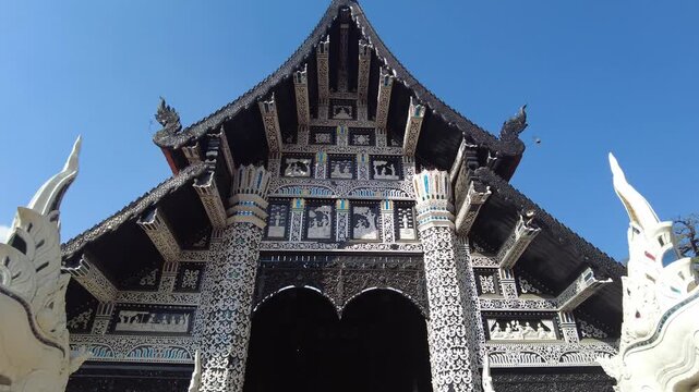 looking up to the rooftop of the entrance of Wat Lok Moli temple Chiang Mai.