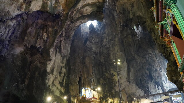 Inside a Cave with Stalactites and a View to the Sky