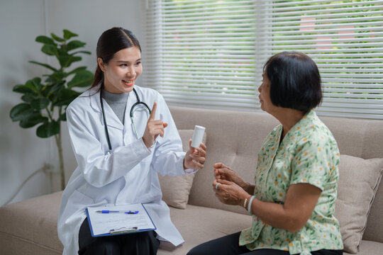 Doctor consulting senior patient about medication at home