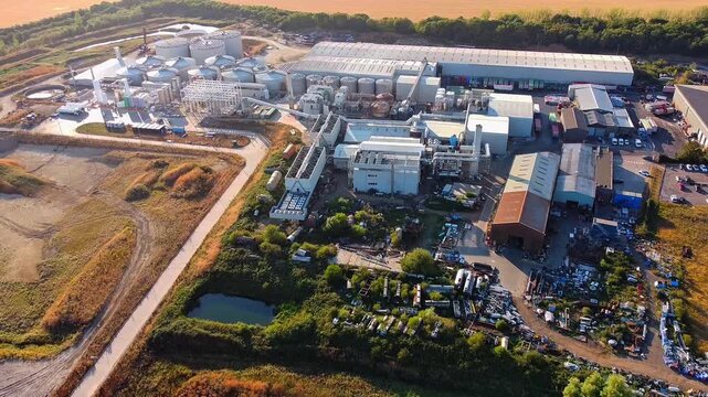 Aerial view of RenEco industrial facility featuring storage tanks and warehouses in Wymington, England, United Kingdom.
