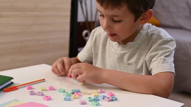Focused Little Boy Solving Simple Addition with Colorful Math Blocks at Home, Early Childhood Education, STEM Learning, Homeschooling, Cognitive Development, Learning Through Play