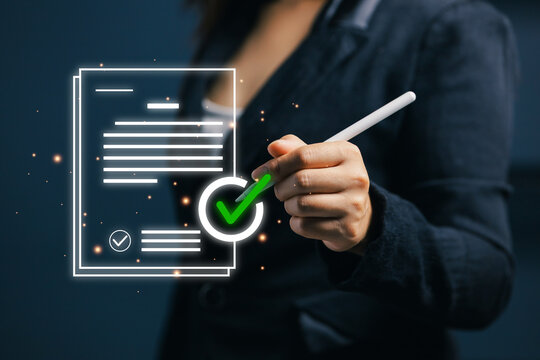 Businesswoman using stylus with glowing digital document and green check mark, representing approval, compliance, verification, contract review, quality control, and online workflow.