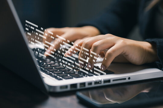Close-up of businesswoman typing on laptop with abstract digital code overlay, representing software development, programming, data processing, technology, cybersecurity, and innovation.