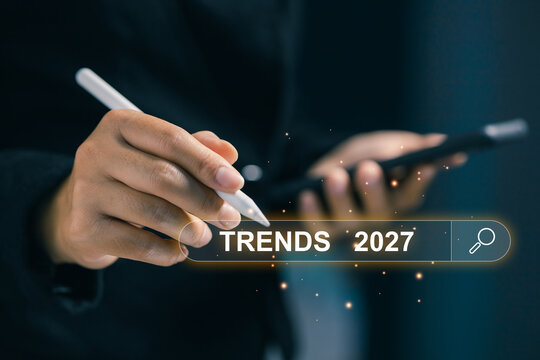 Business professional using stylus and smartphone with a digital Trends 2027 search interface, representing market research, forecasting, innovation, analytics, and future strategy.
