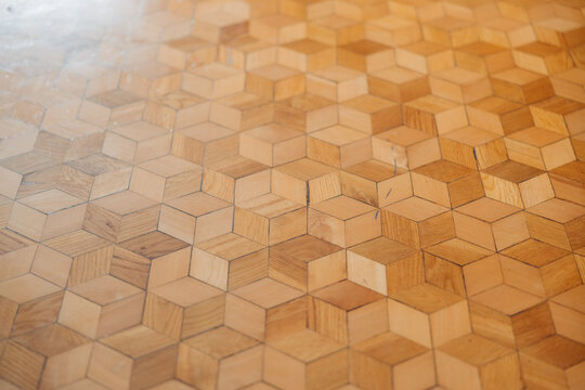 Handmade geometric wooden flooring with natural wood texture