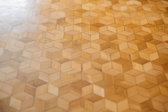 Handmade geometric wooden flooring with natural wood texture