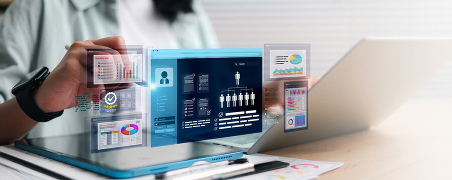 Marketer using digital marketing dashboard with charts, pie graphs, organization chart, and performance data.